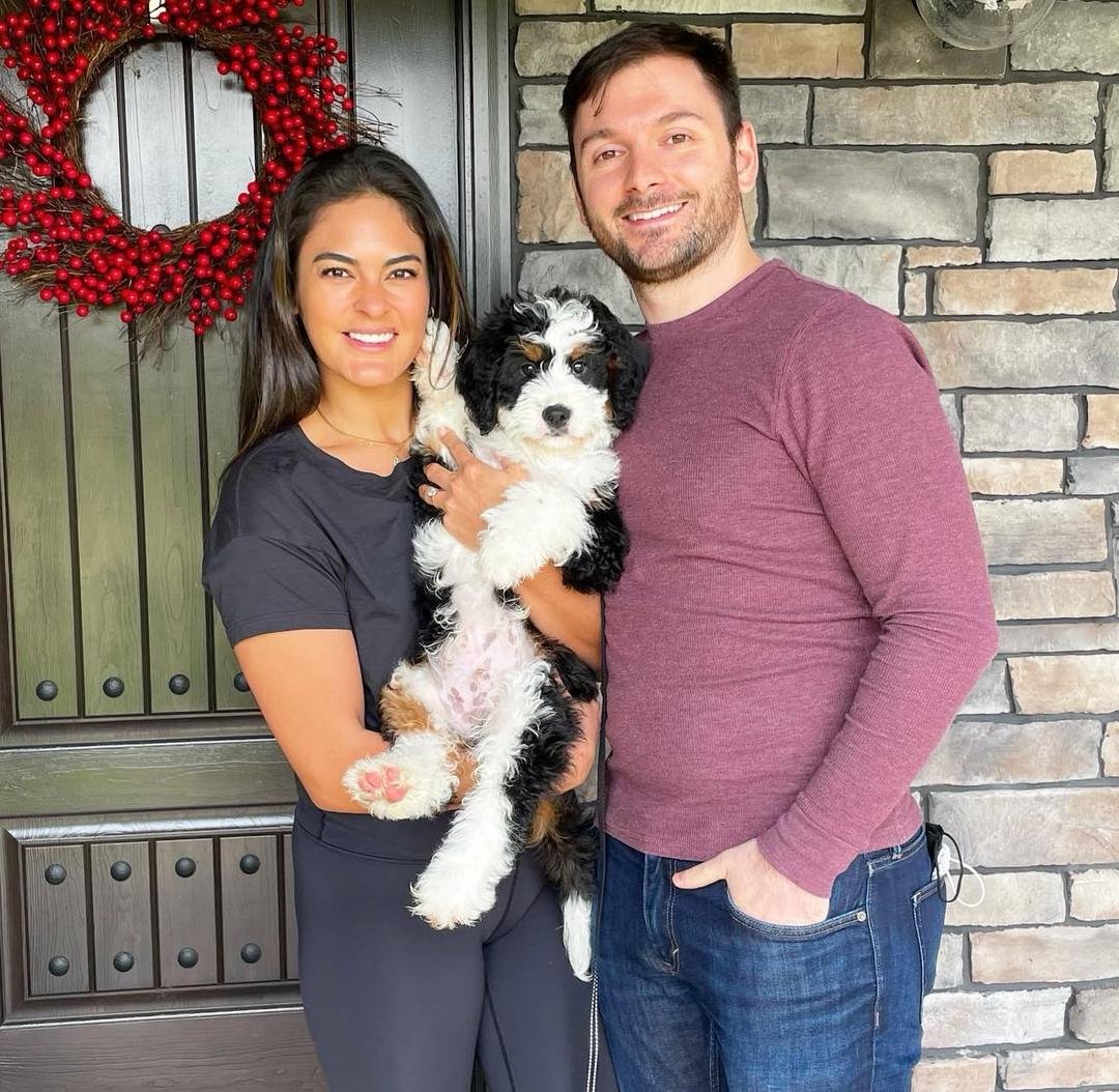 Happy family with puppy