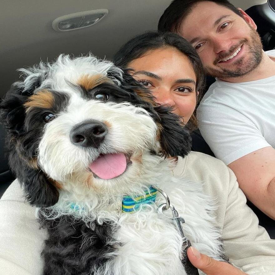 Happy family with puppy