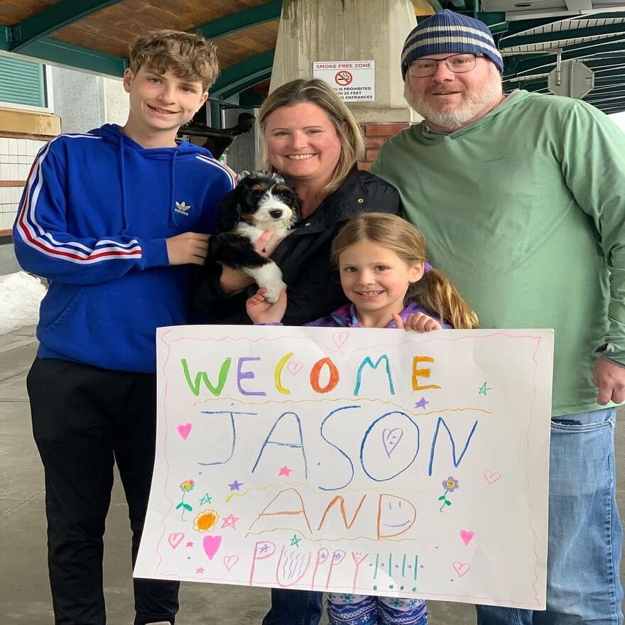 Happy family with puppy